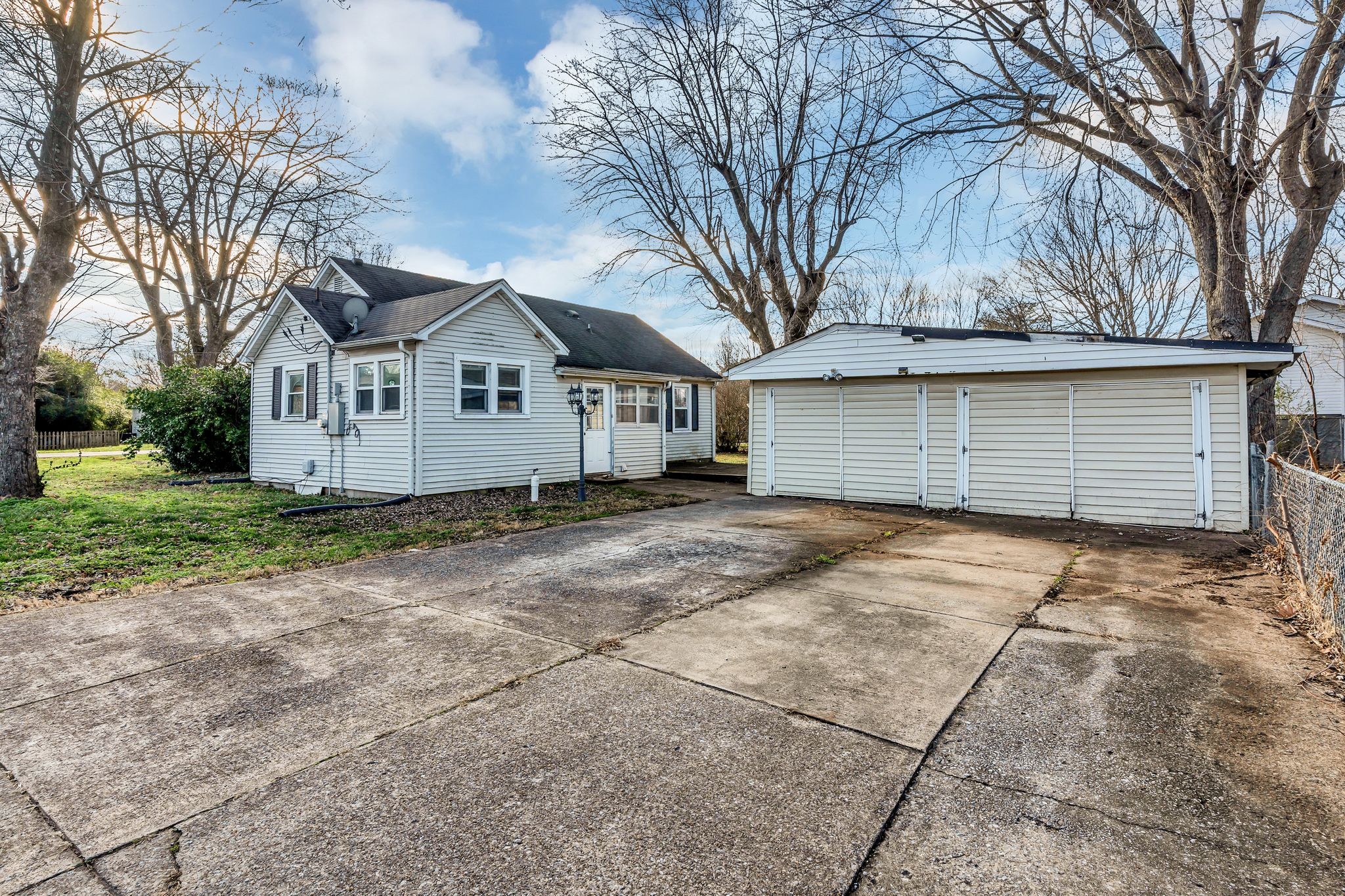 404 Gibson Street Portland, TN 37148 - Photo 23 of 26 a front view of a house with a yard and garage