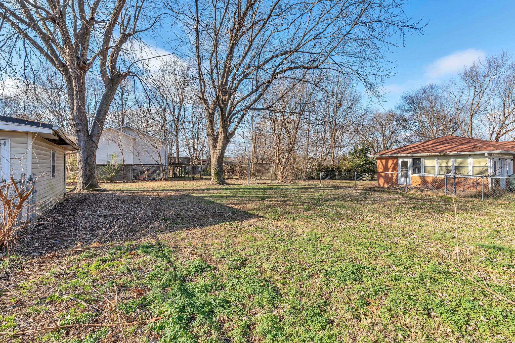 404 Gibson Street Portland, TN 37148 - Photo 6 of 26 a front view of house with yard and trees around