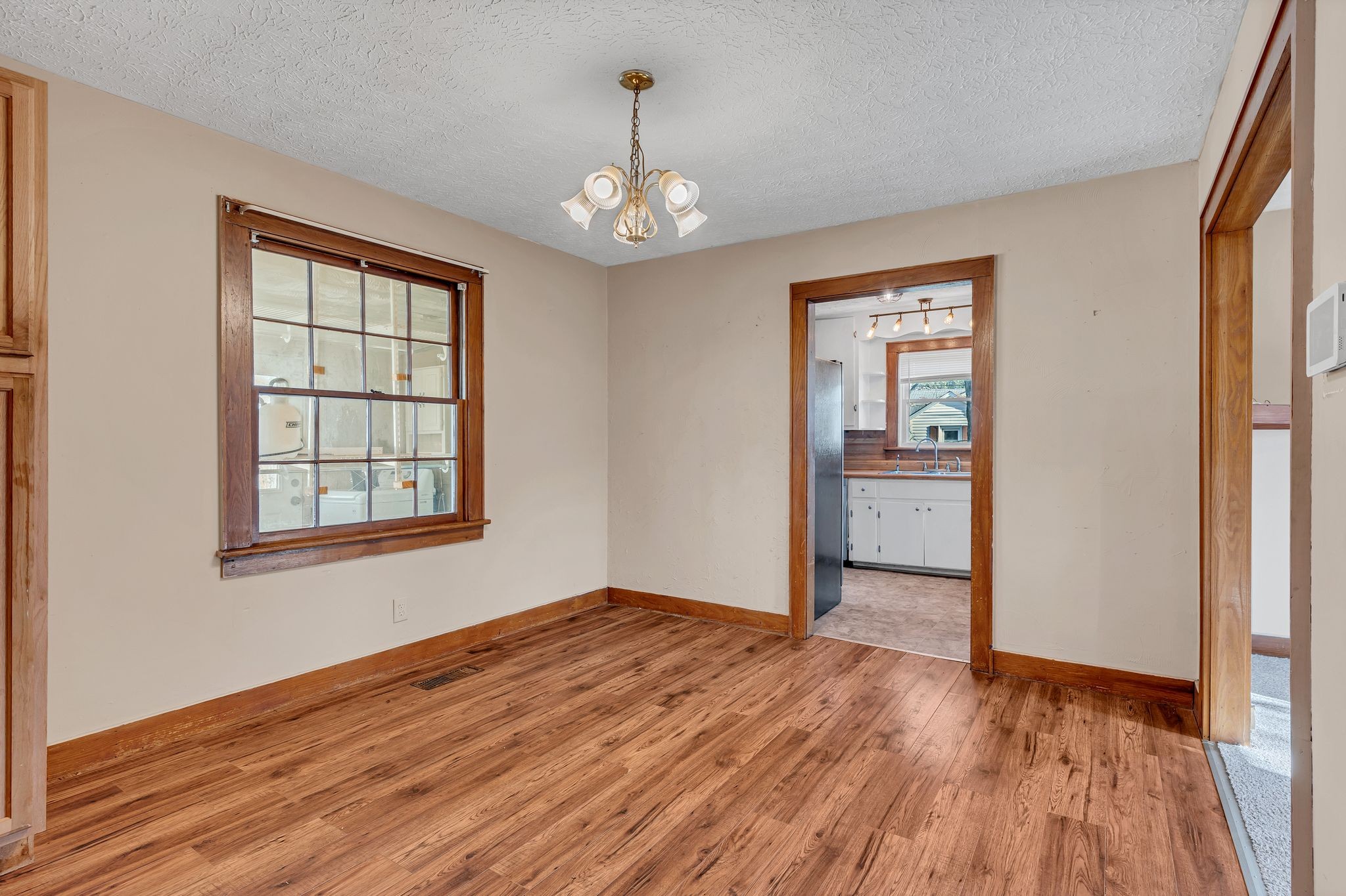 404 Gibson Street Portland, TN 37148 - Photo 9 of 26 a view of an empty room with wooden floor and a window
