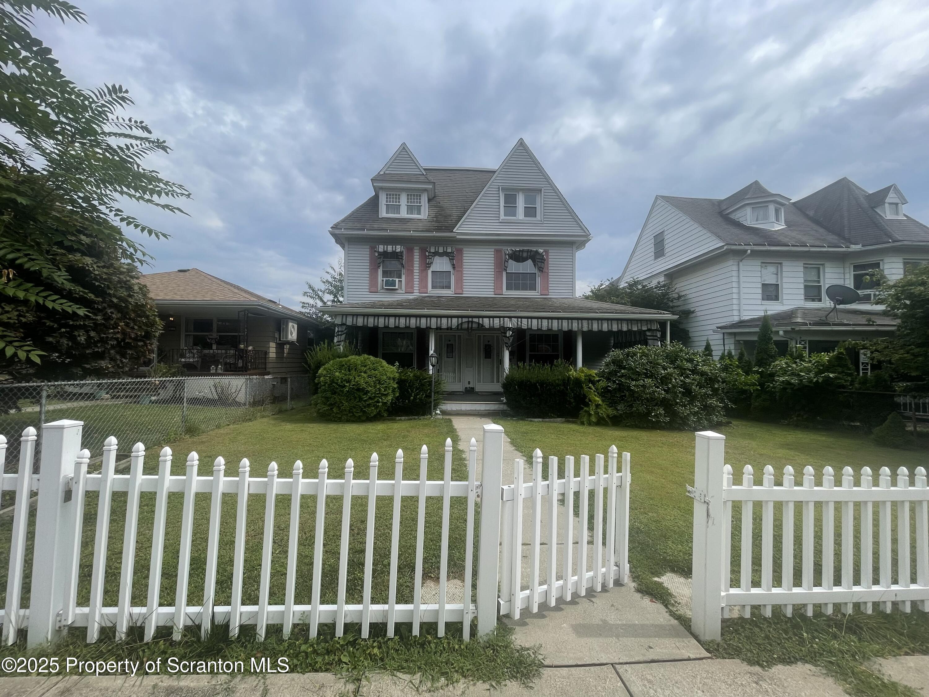 608 North Sumner Avenue, Unit 608 Scranton, PA 18504 - Photo 1 of 22 a front view of a house with a garden