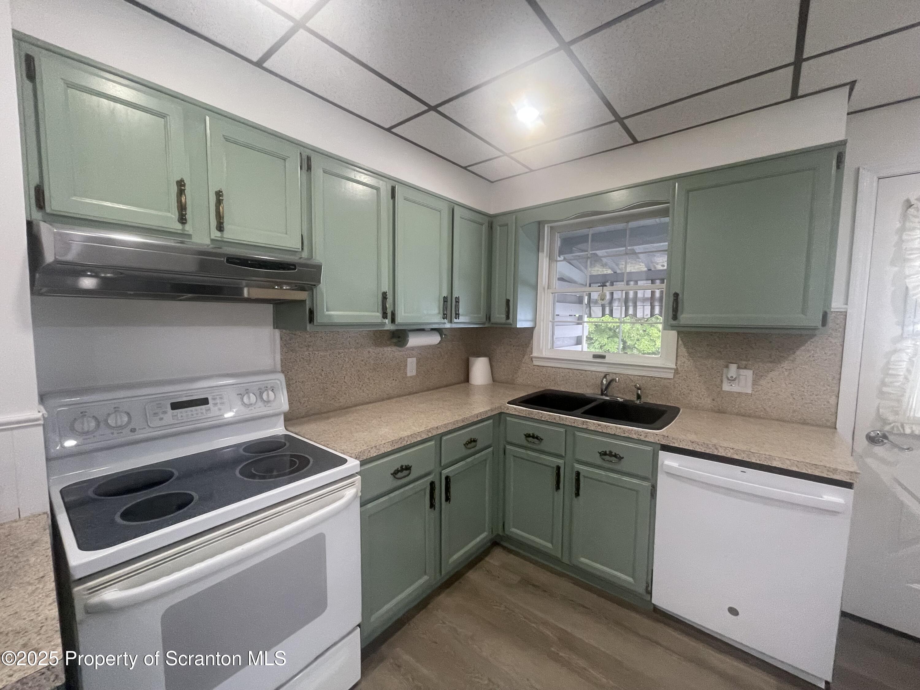 608 North Sumner Avenue, Unit 608 Scranton, PA 18504 - Photo 2 of 22 a kitchen with a stove and a sink