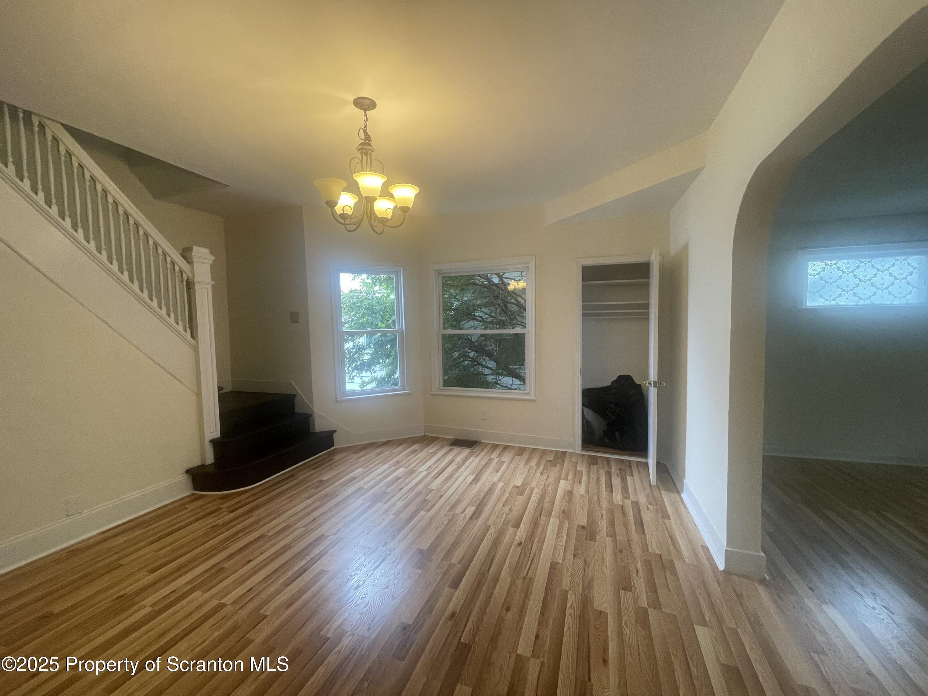 608 North Sumner Avenue, Unit 608 Scranton, PA 18504 - Photo 4 of 22 wooden floor in an empty room with a window