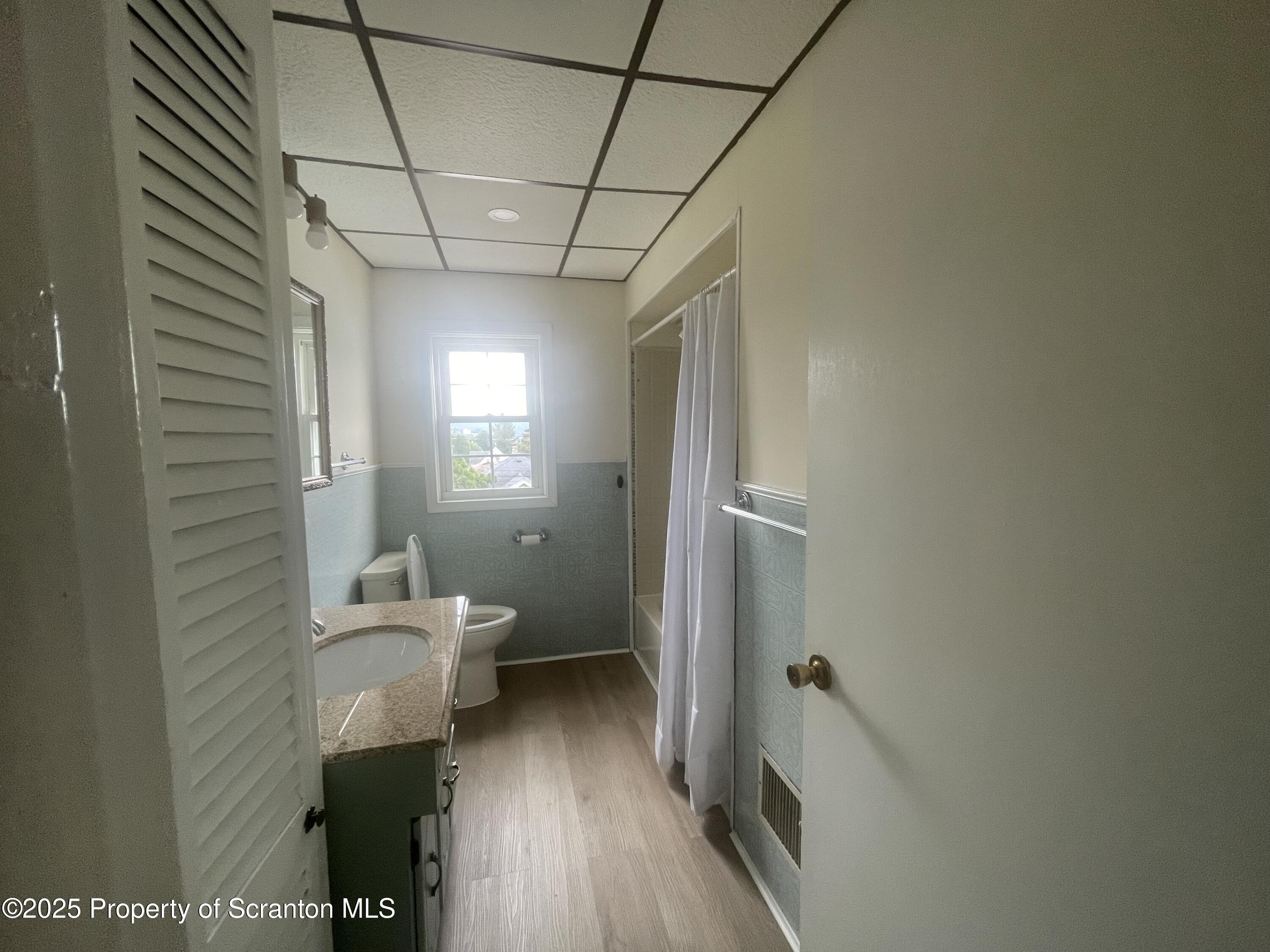608 North Sumner Avenue, Unit 608 Scranton, PA 18504 - Photo 6 of 22 a bathroom with a toilet sink and shower
