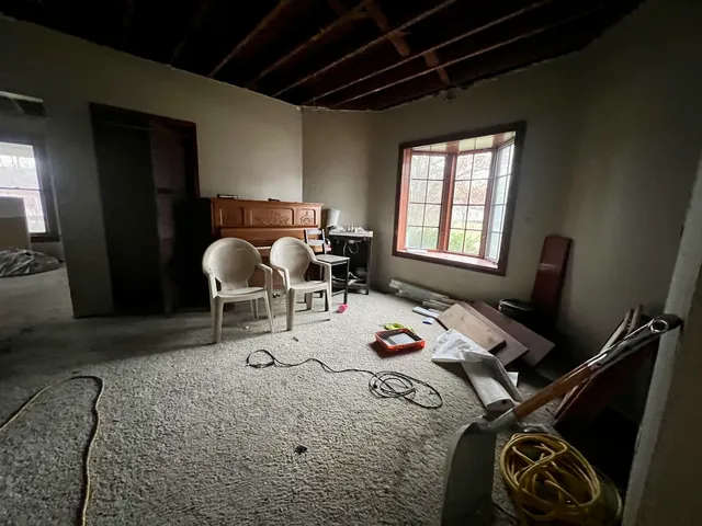 a workspace with furniture and window