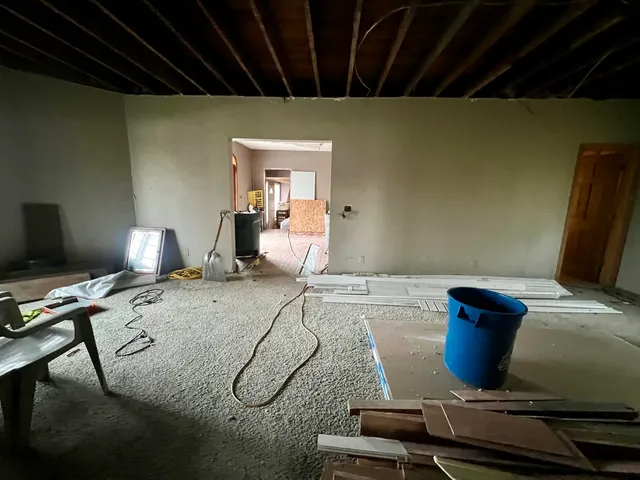 a bedroom with a bed and a desk