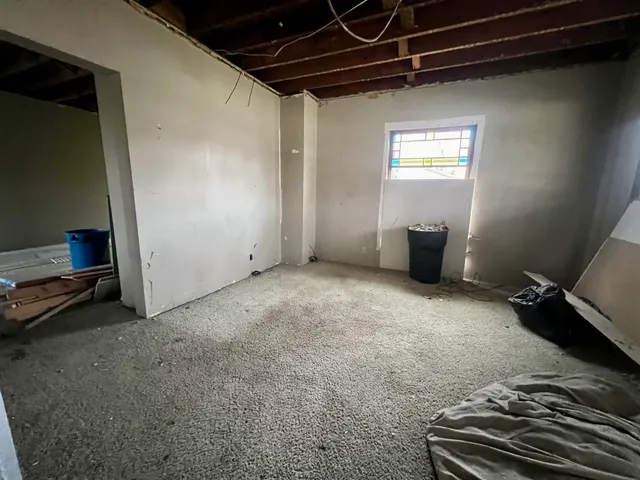 a view of livingroom with furniture and window