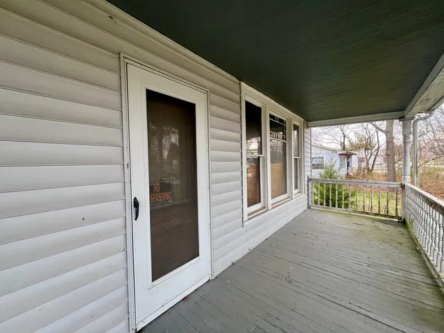 a view of front door and deck