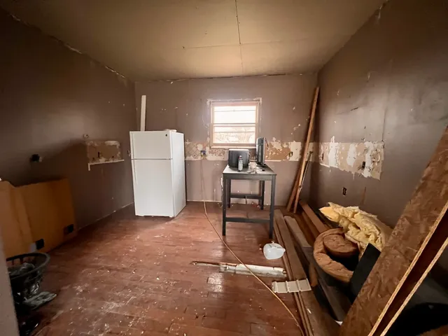 a view of a hallway with seating area