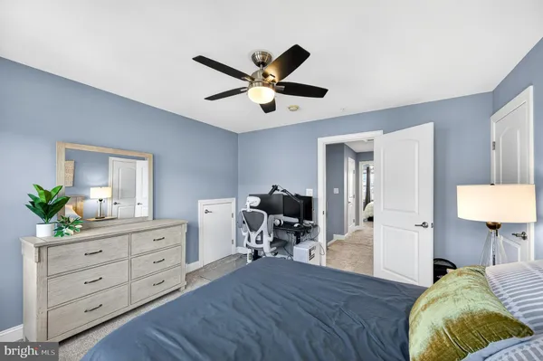 a bed room with a bed and a chandelier