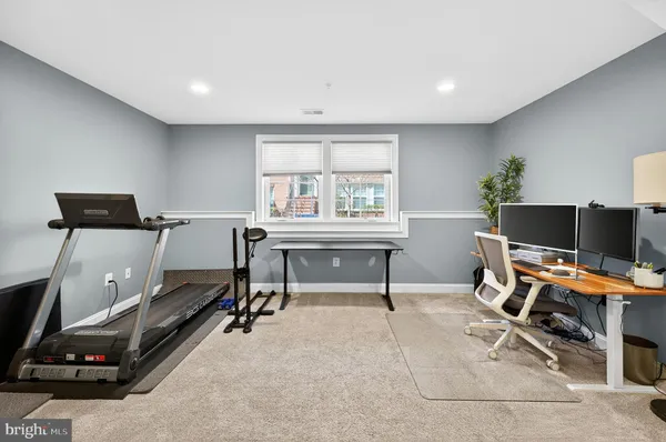 a workspace with furniture and a window