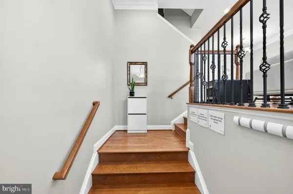 a view of staircase with white walls and windows