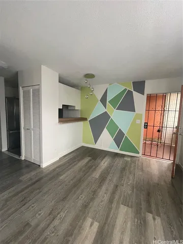 a view of a hallway with the wooden floor