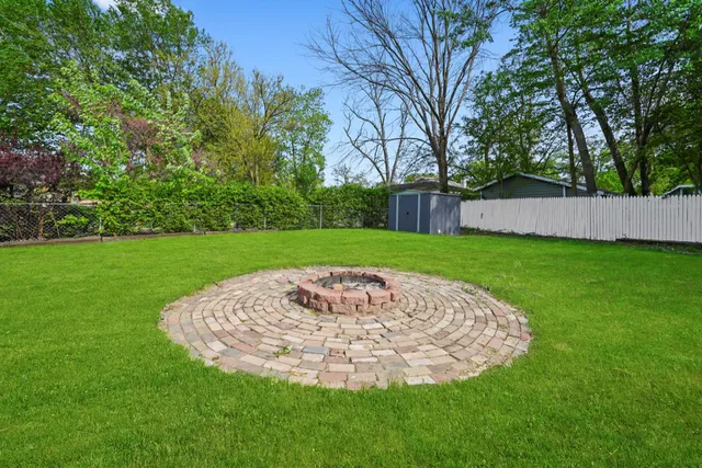 a view of a swimming pool with a yard