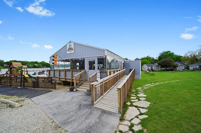 a view of a swimming pool with a bench and couch
