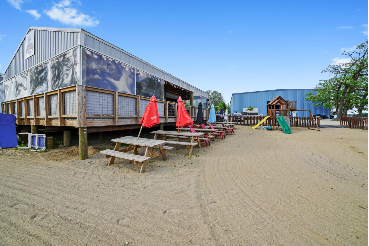 26427 West Prospect Avenue Antioch, IL 60002 - Photo 21 of 22 a view of a swimming pool with a bench and couch