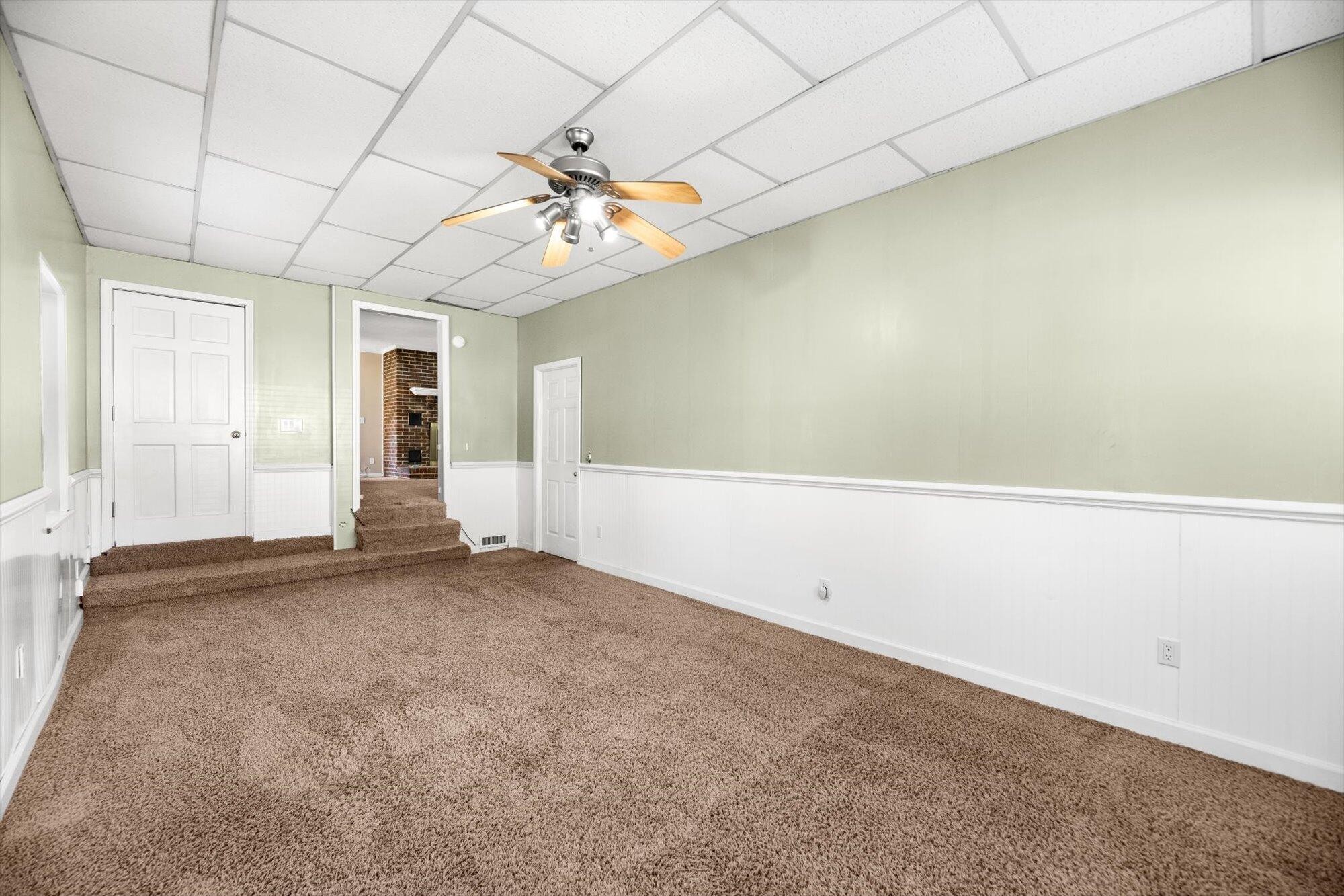 1302 Ridgeway Circle Athens, TN 37303 - Photo 11 of 17 wooden floor in an empty room with a window