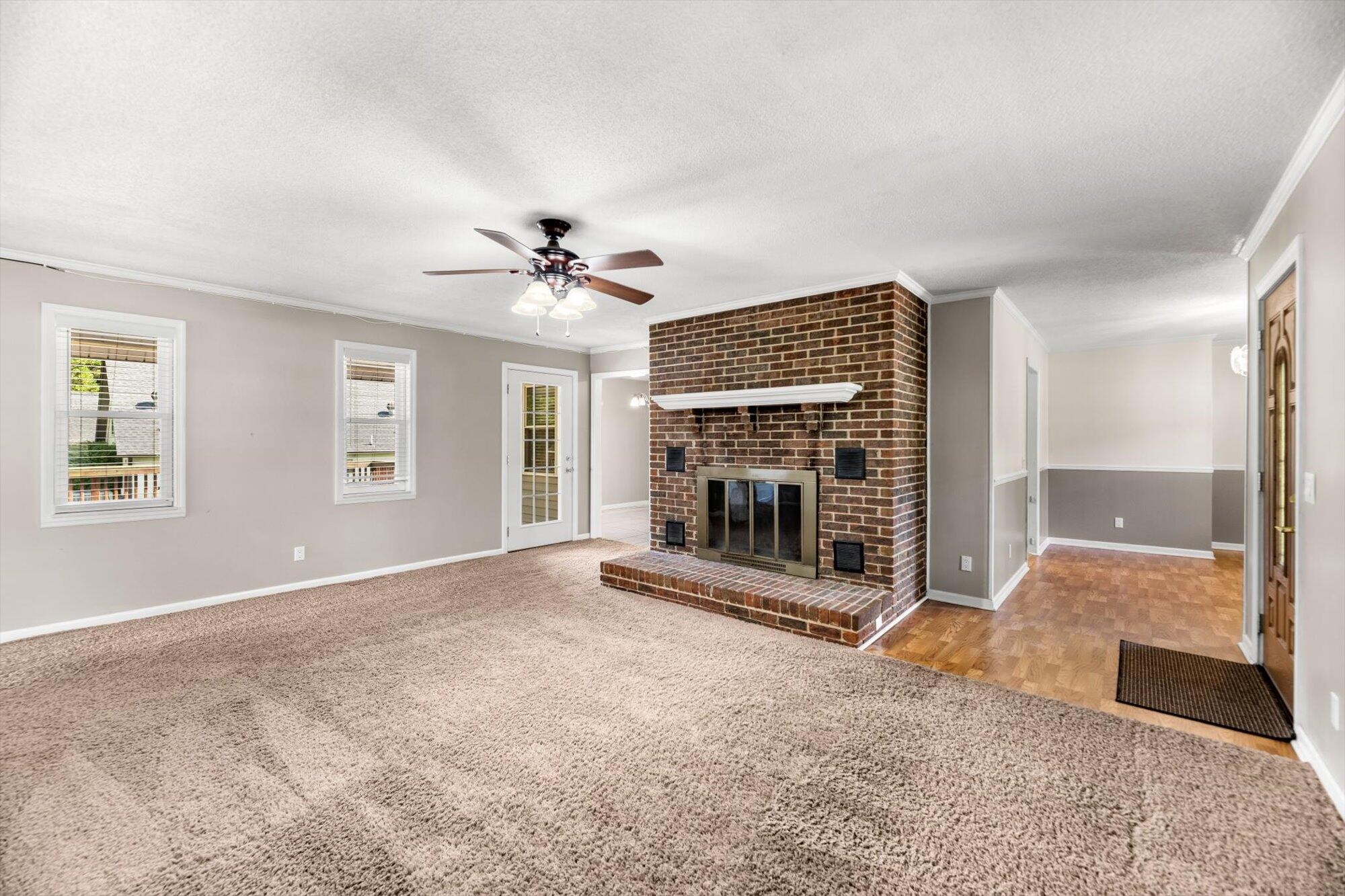 1302 Ridgeway Circle Athens, TN 37303 - Photo 5 of 17 an empty room with fireplace and windows