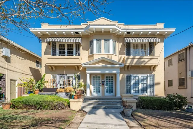 a view of a building with sitting area