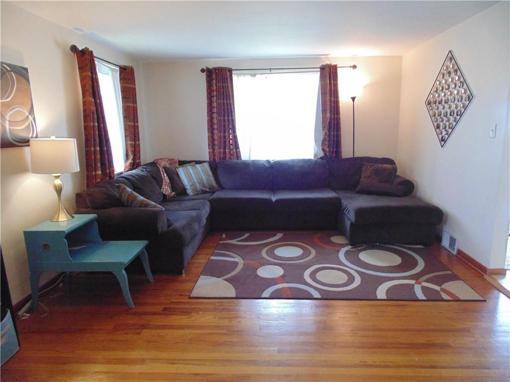 500 Walnut Street Springdale, PA 15144 - Photo 6 of 16 Living room--Gleaming hardwood floors and lots of natural light.