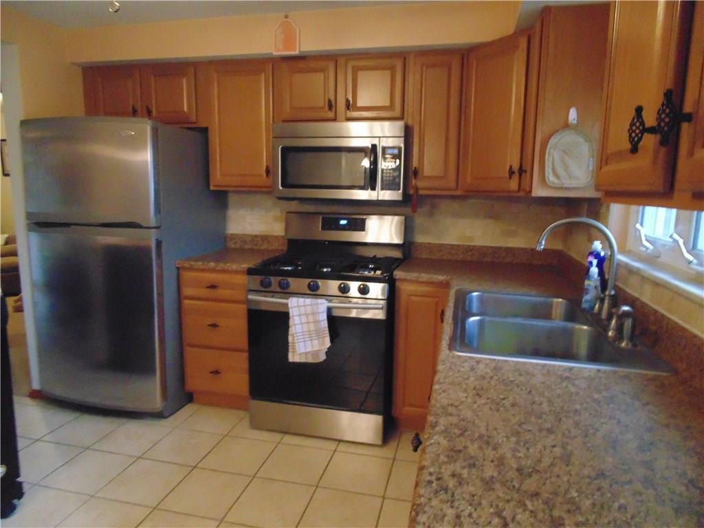 500 Walnut Street Springdale, PA 15144 - Photo 9 of 16 Kitchen--Beautifully updated with stainless steel appliances.