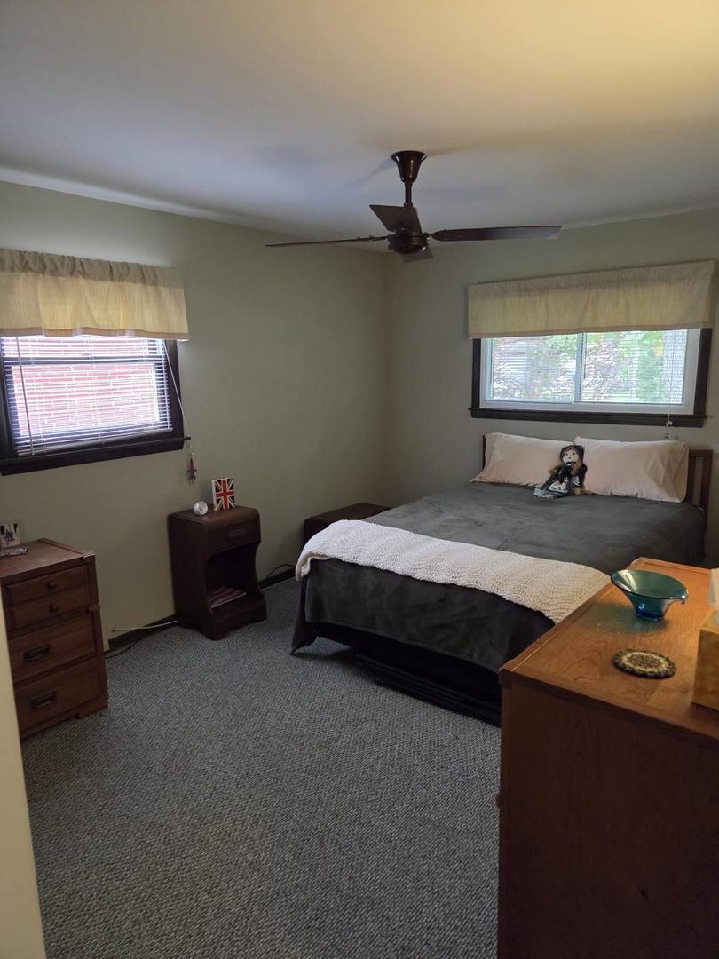 215 Brice Avenue Mundelein, IL 60060 - Photo 10 of 15 a bedroom with a bed and a flat screen tv