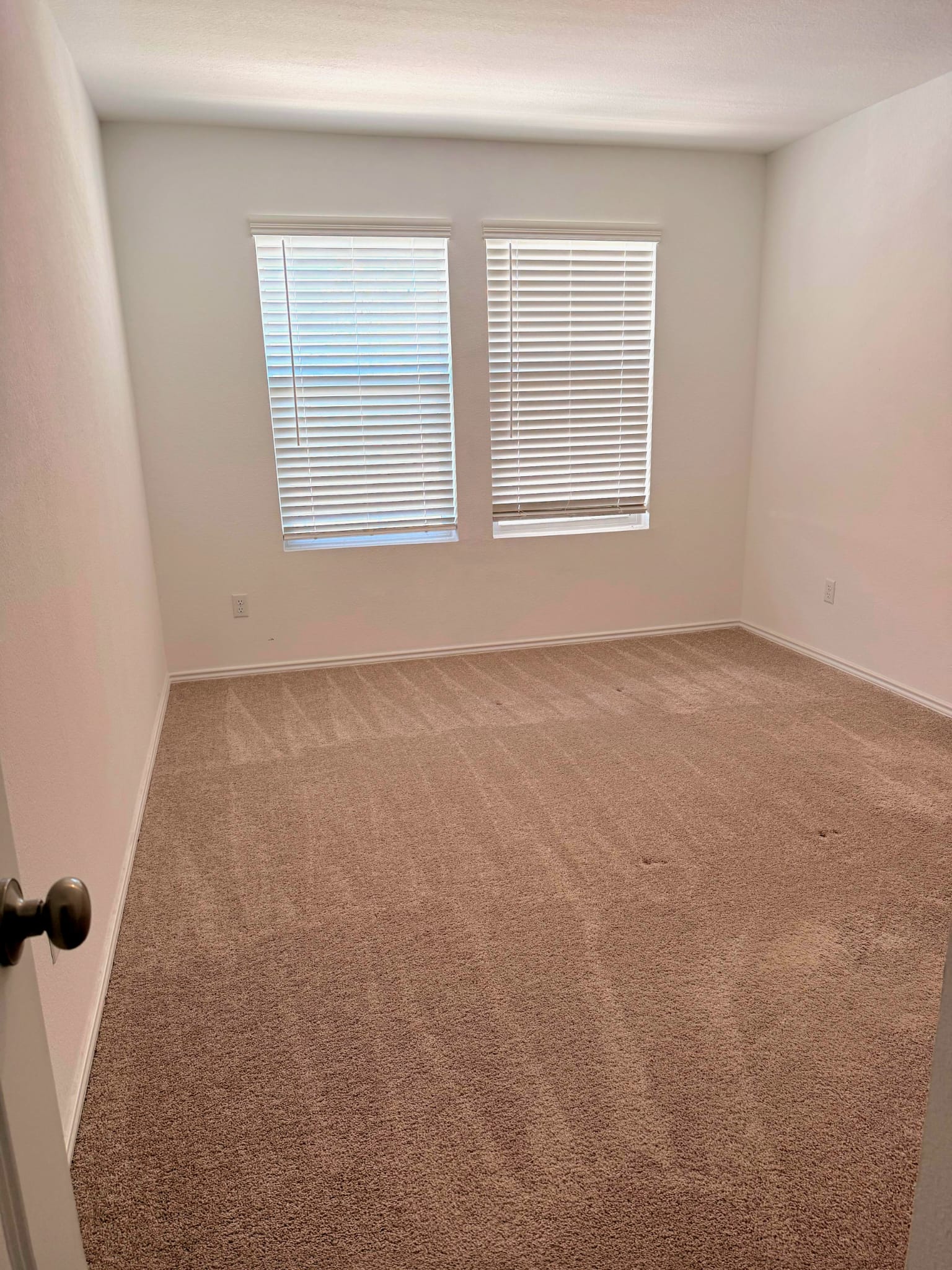 2520 Four Waters Loop Georgetown, TX 78628 - Photo 3 of 15 Spare room with light carpet and baseboards