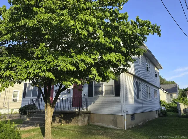 a view of house with trees in the background