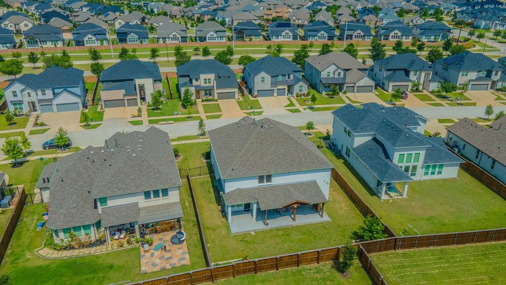2521 Maidenhair Road Frisco, TX 75033 - Photo 39 of 39 Aerial view showcasing a collection of contemporary homes with consistent architectural styles