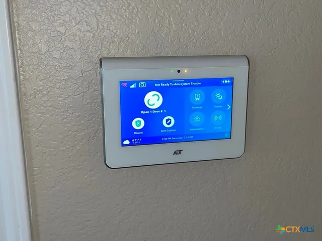 a view of an empty room with a ceiling fan