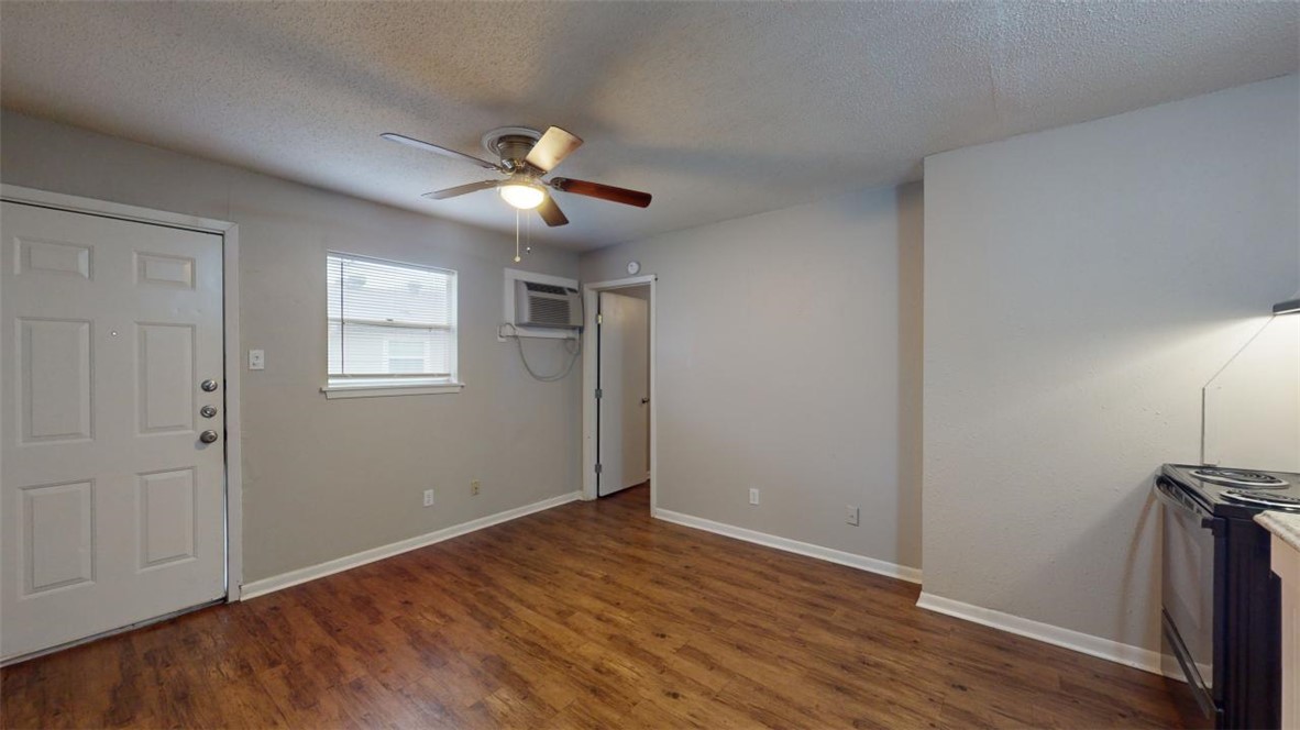 500 Foch Street, Unit 11 Bryan, TX 77801 - Photo 3 of 11 a view of empty room with wooden floor and fan