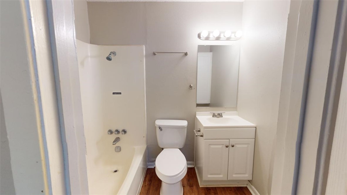 500 Foch Street, Unit 11 Bryan, TX 77801 - Photo 7 of 11 a bathroom with a toilet a sink and shower