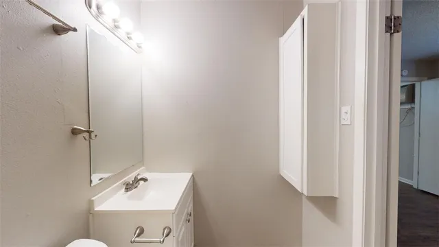 a bathroom with a sink and mirror