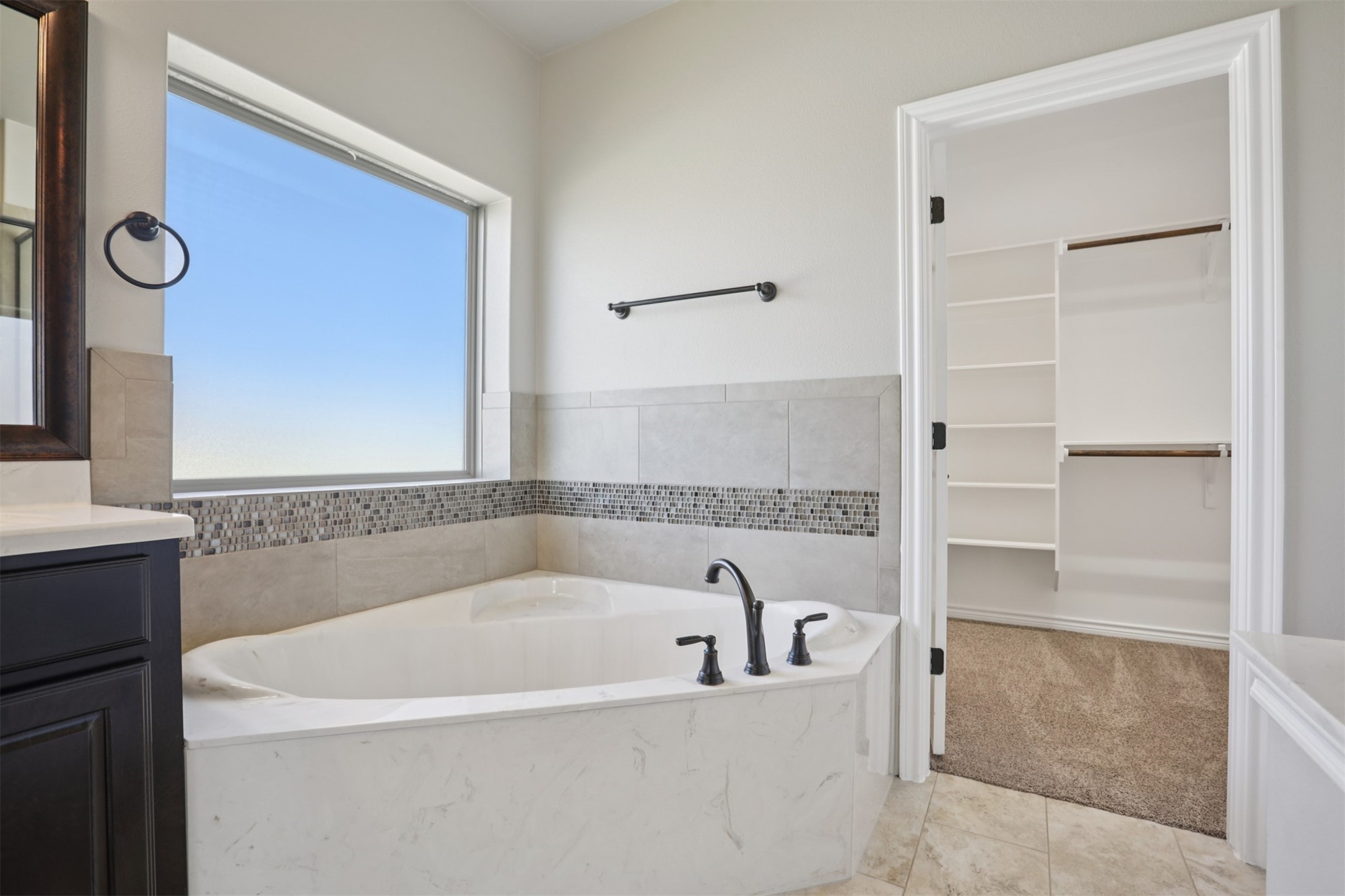 500 Seabiscuit Drive Jarrell, TX 76537 - Photo 18 of 33 a white bath tub sitting next to a shower