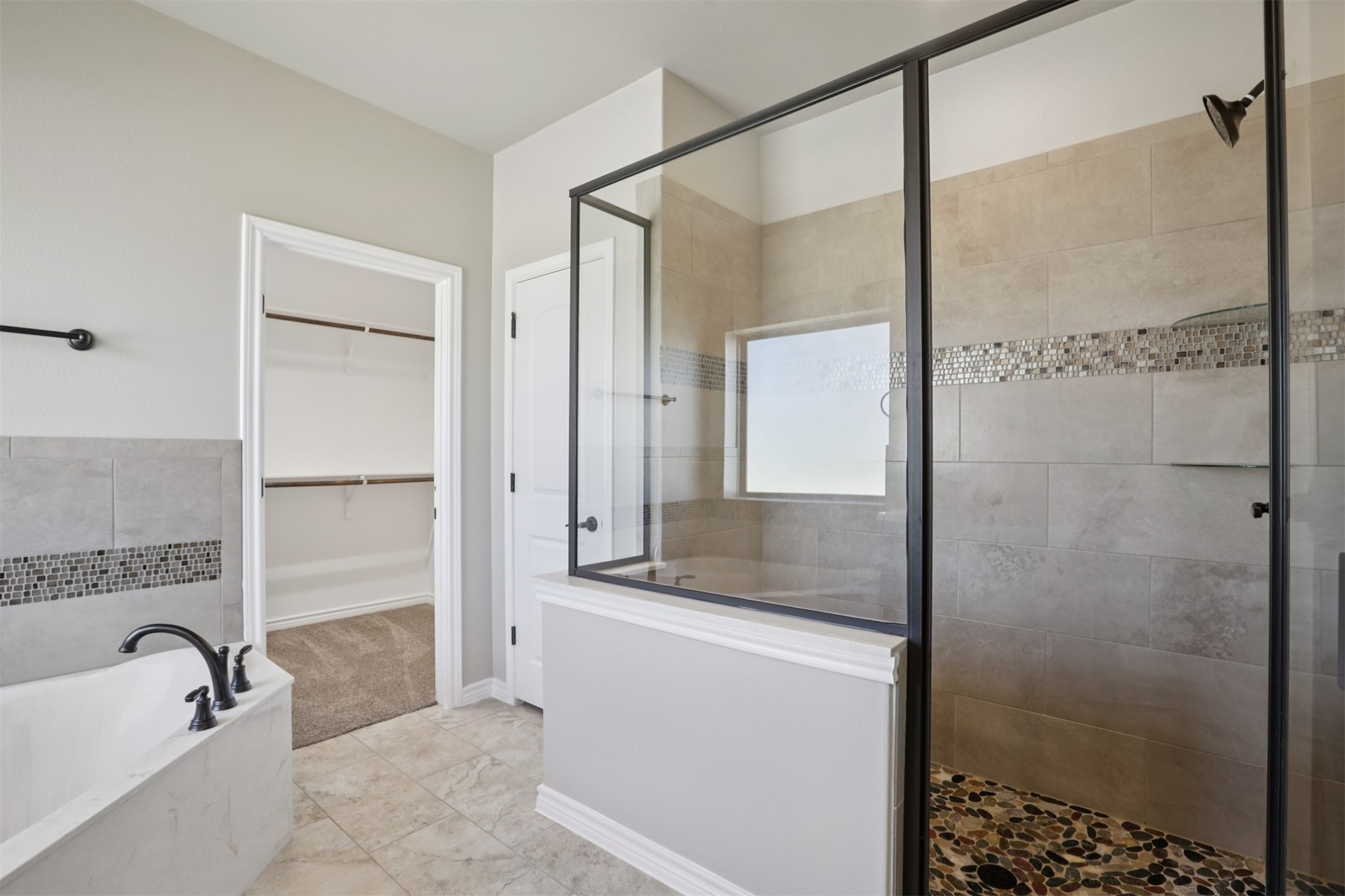500 Seabiscuit Drive Jarrell, TX 76537 - Photo 19 of 33 a bathroom with a granite countertop bathtub shower sink and mirror