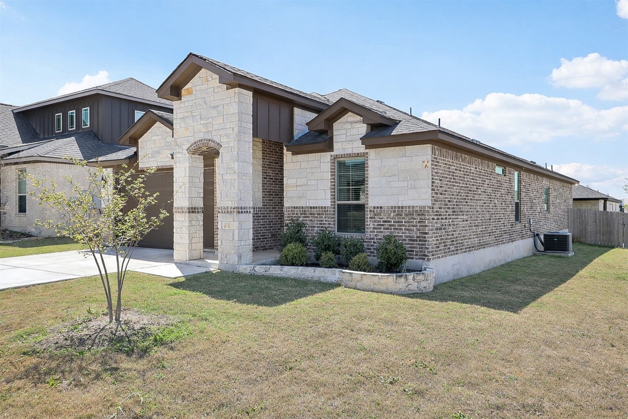 500 Seabiscuit Drive Jarrell, TX 76537 - Photo 2 of 33 a front view of a house with a yard and garage