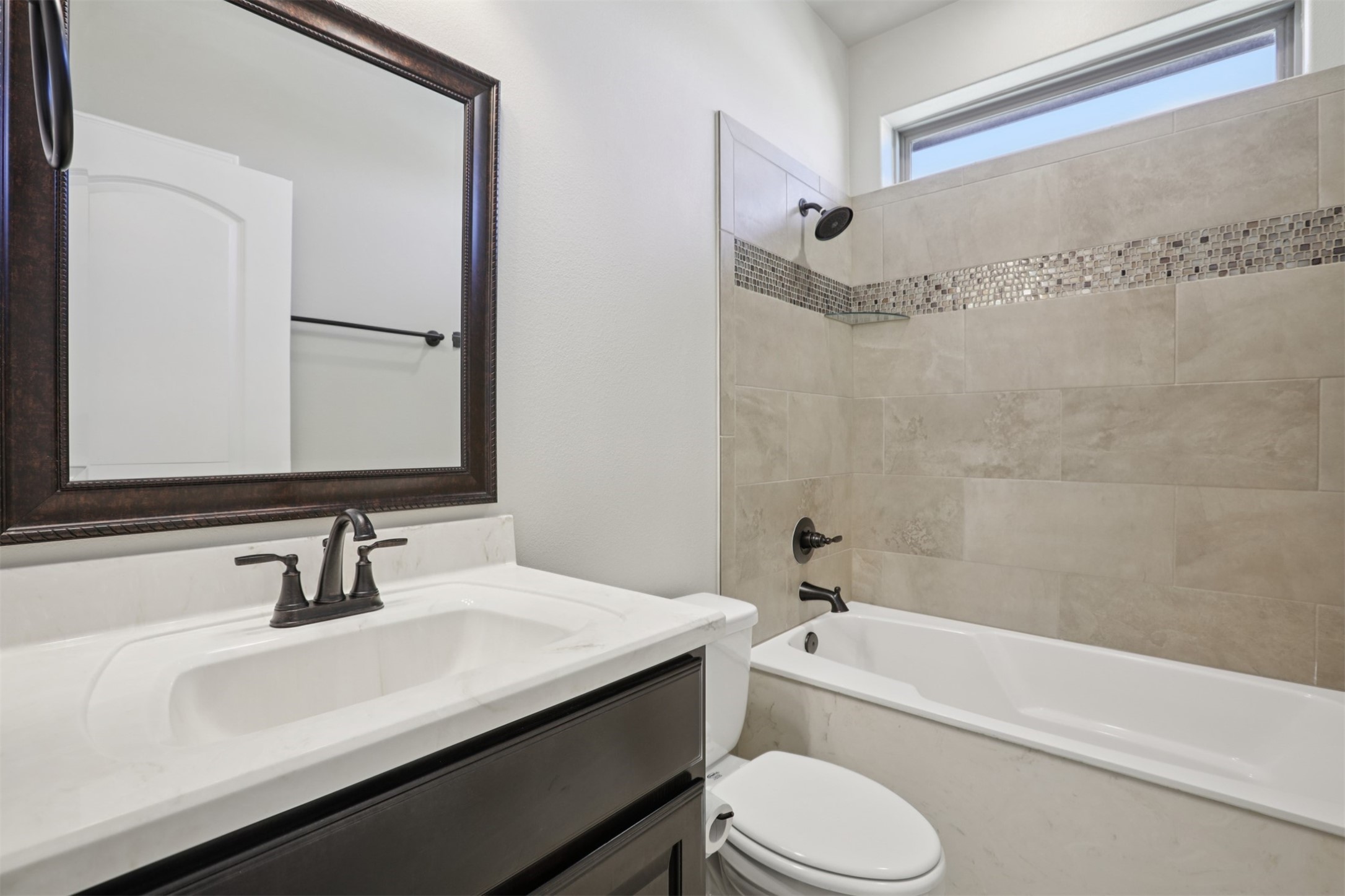 500 Seabiscuit Drive Jarrell, TX 76537 - Photo 23 of 33 a bathroom with a sink a toilet and a bathtub