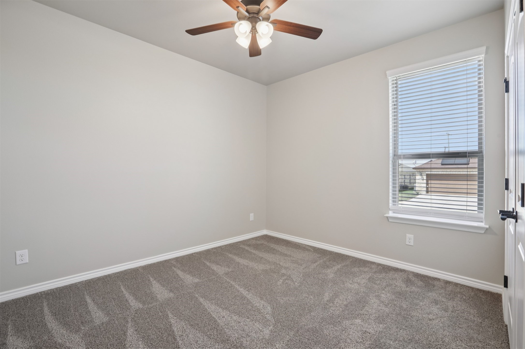 500 Seabiscuit Drive Jarrell, TX 76537 - Photo 24 of 33 an empty room with a window and a fan
