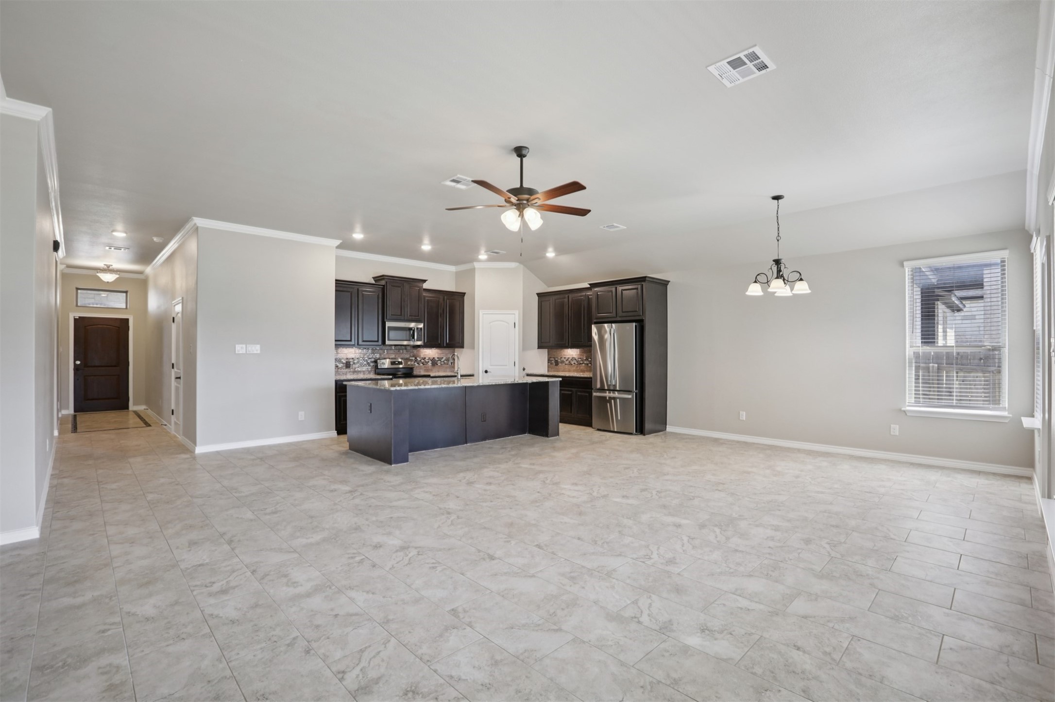 500 Seabiscuit Drive Jarrell, TX 76537 - Photo 6 of 33 a view of a kitchen with a sink and a kitchen