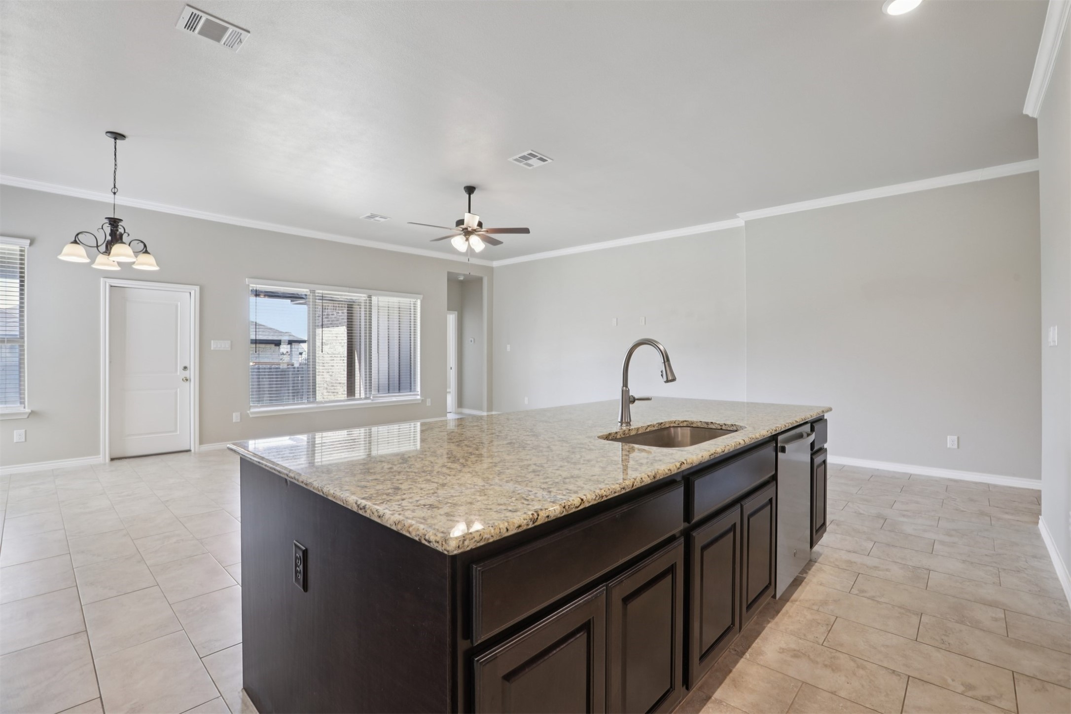 500 Seabiscuit Drive Jarrell, TX 76537 - Photo 10 of 33 a kitchen with a sink and cabinets