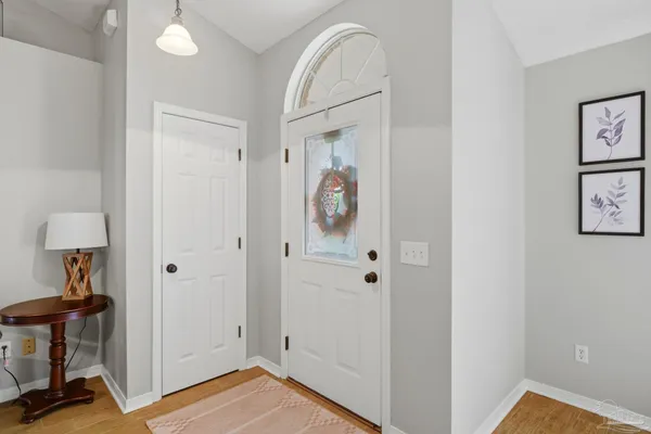 a view of hallway with livingroom and furniture