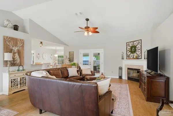 a living room with fireplace furniture and a flat screen tv