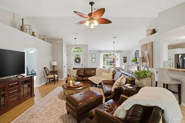 a living room with furniture and a flat screen tv