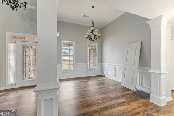 a view of livingroom with hardwood floor and hallway