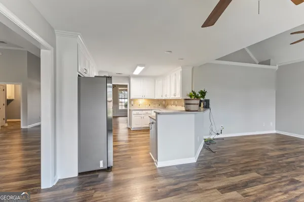 a view of kitchen view wooden floor and window
