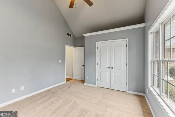 a view of an empty room with a window