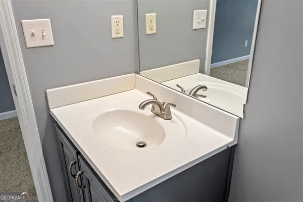 a bathroom with a sink and a washing machine