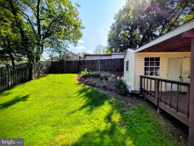 a view of a backyard with a small cabin