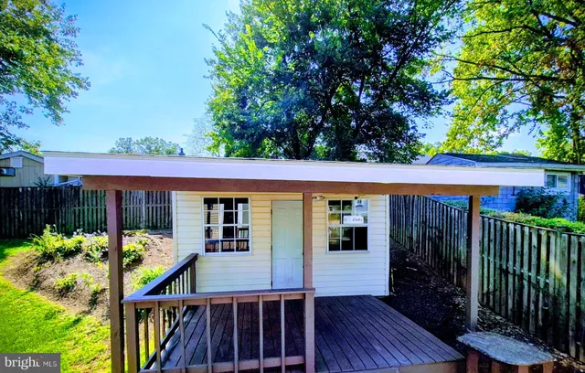 a view of a house with porch and wooden floor