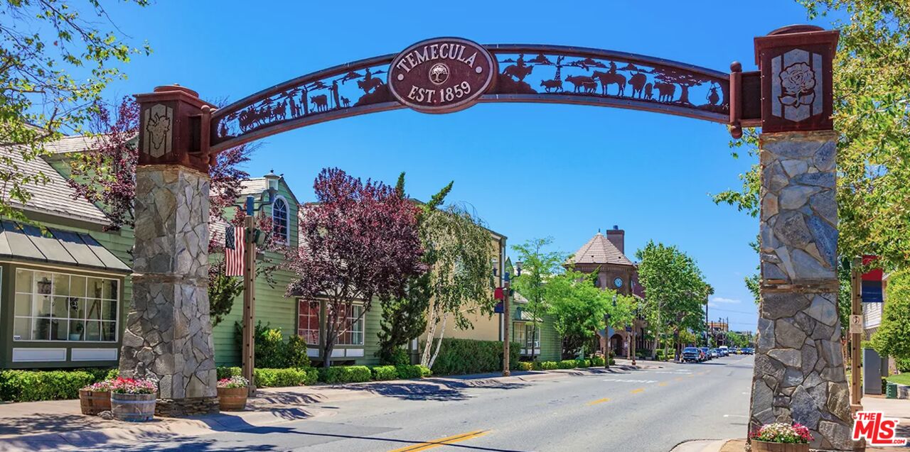 41322 De Luz Road, Unit 15 Fallbrook, CA 92028 - Photo 23 of 24 a front view of a building with garden