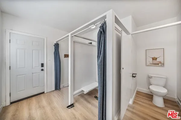 a bathroom with a shower and a toilet